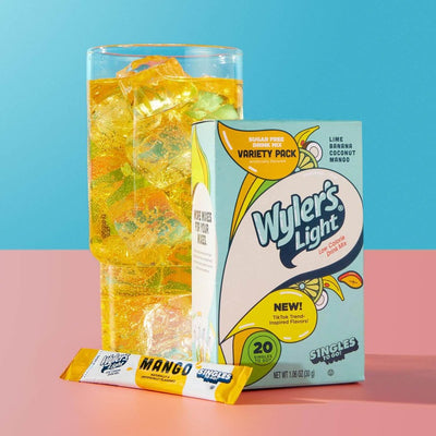 Viral Vibes, Viral Vibes Drink Mixed With Water in A Glass, Mango Flavored Drink Mix, Wyler's Mocktail Starters
